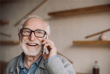 An older man talking on the phone