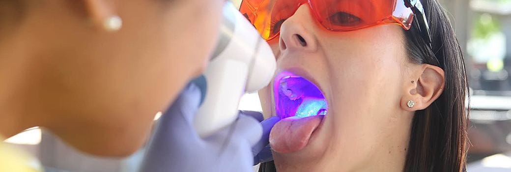 woman getting oral cancer screening